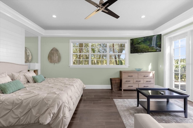 bedroom featuring multiple windows, ceiling fan, and dark hardwood / wood-style floors