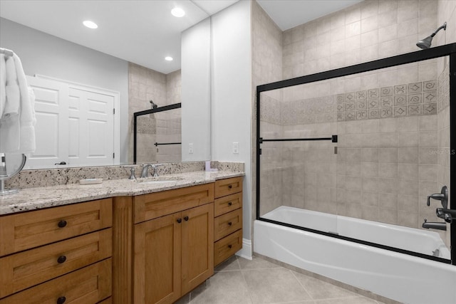 bathroom featuring bath / shower combo with glass door, vanity, and tile patterned floors