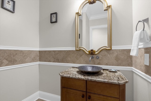 bathroom featuring ornamental molding and vanity