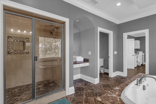 full bathroom featuring independent shower and bath, toilet, crown molding, and sink