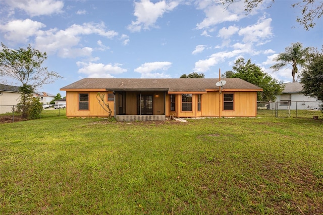 back of house featuring a yard