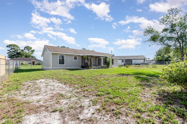 3186 Mapleshade St, Deltona, FL 32738 - rear view of property featuring a sunroom