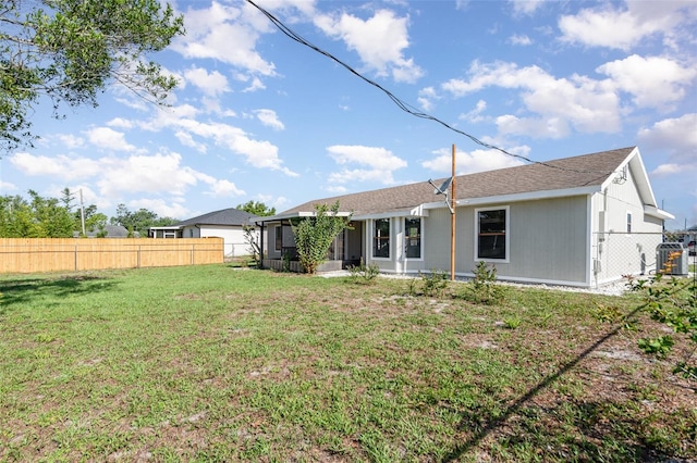 3186 Mapleshade St, Deltona, FL 32738 - rear view of house featuring a sunroom