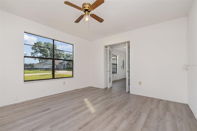 3186 Mapleshade St, Deltona, FL 32738 - spare room featuring light wood-style floors and a ceiling fan