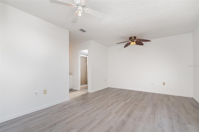 3186 Mapleshade St, Deltona, FL 32738 - spare room with a ceiling fan, light wood-style floors, baseboards, and a textured ceiling