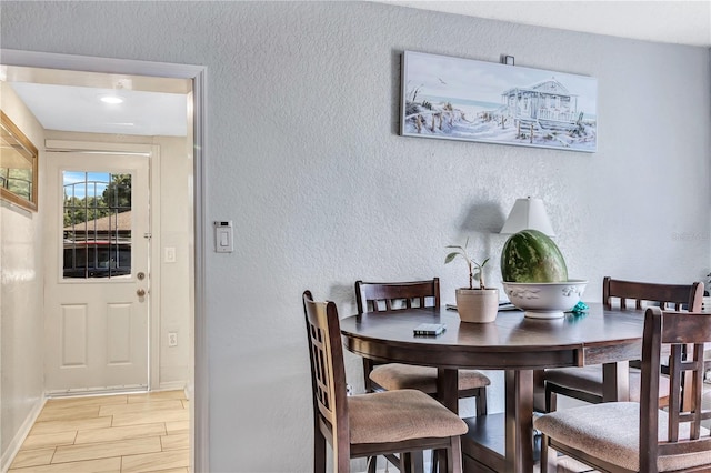 dining area featuring light wood-type flooring