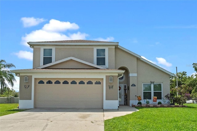 view of front facade with a garage and a front yard