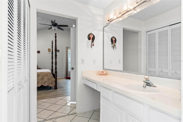 bathroom with tile patterned floors, ceiling fan, and vanity