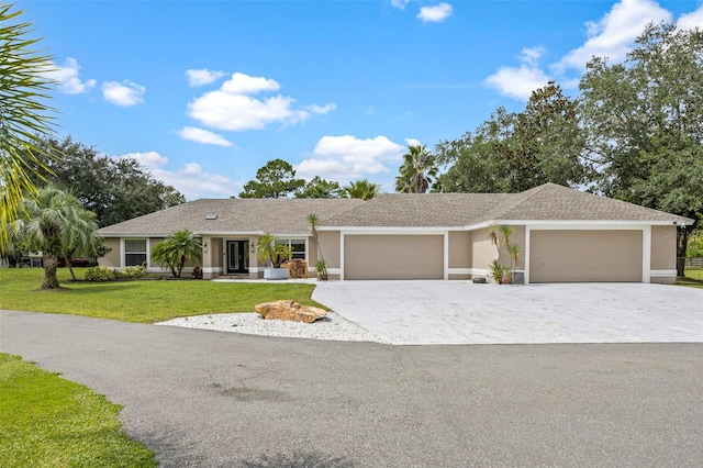 ranch-style home with a front yard and a garage