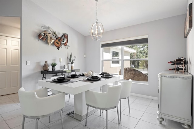 dining room featuring light tile patterned floors and a chandelier