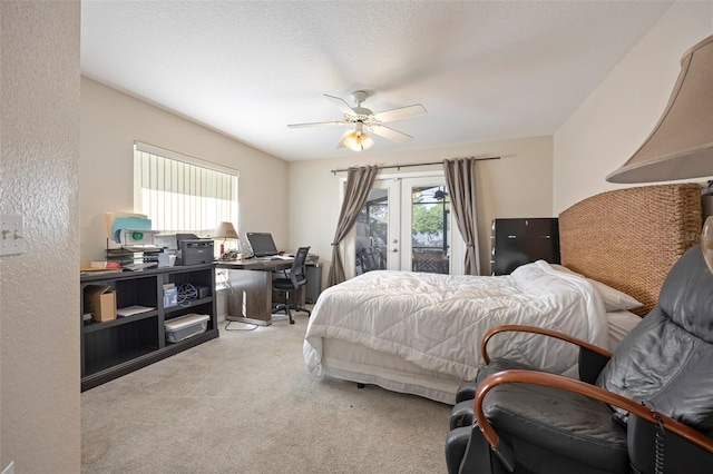 bedroom featuring ceiling fan, light colored carpet, french doors, and access to exterior