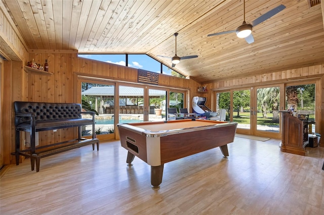 recreation room featuring ceiling fan, wood ceiling, wood walls, and pool table