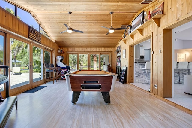 playroom with wooden walls, ceiling fan, light hardwood / wood-style flooring, and billiards