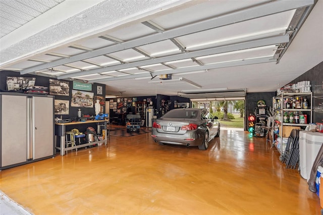 garage with a garage door opener and a carport