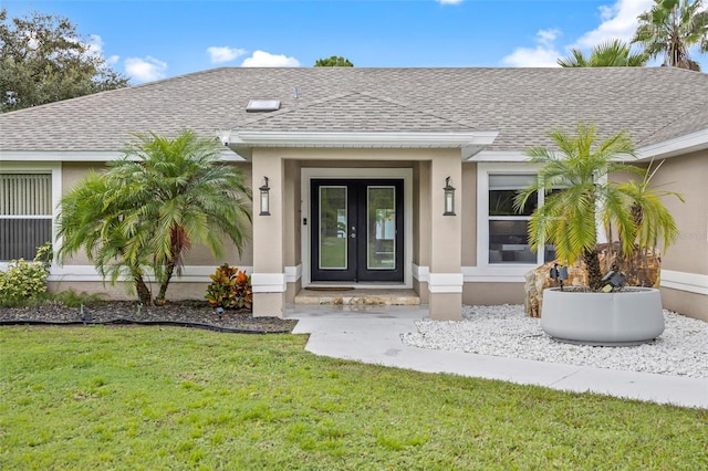 doorway to property featuring a lawn