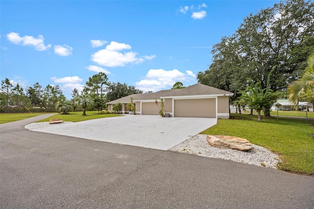 view of front facade with a garage and a front lawn