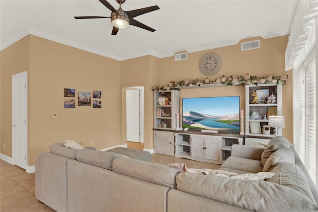 tiled living room with crown molding and ceiling fan