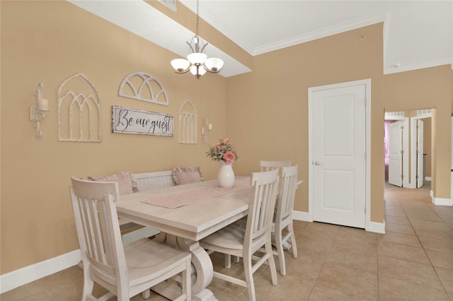 dining room featuring an inviting chandelier, light tile patterned floors, and crown molding