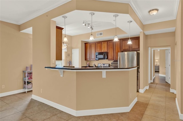 kitchen with hanging light fixtures, kitchen peninsula, ornamental molding, and a kitchen bar