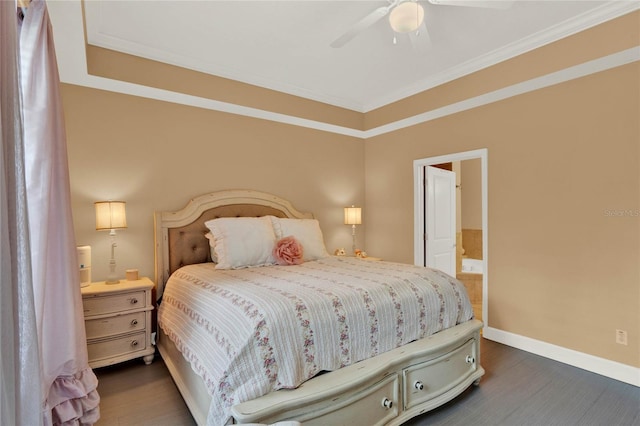 bedroom featuring ceiling fan, ensuite bathroom, dark wood-type flooring, and crown molding