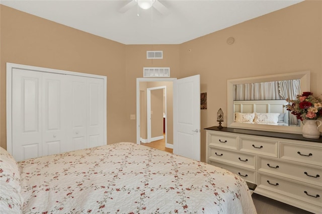 bedroom with ceiling fan and a closet