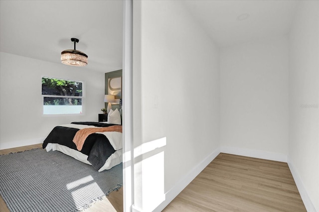 bedroom with light hardwood / wood-style floors