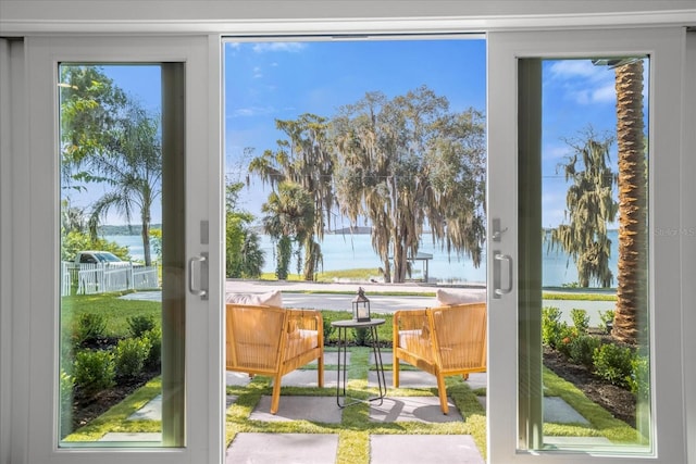 doorway to outside with a water view