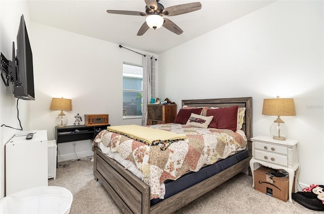 bedroom featuring ceiling fan, light colored carpet, and lofted ceiling