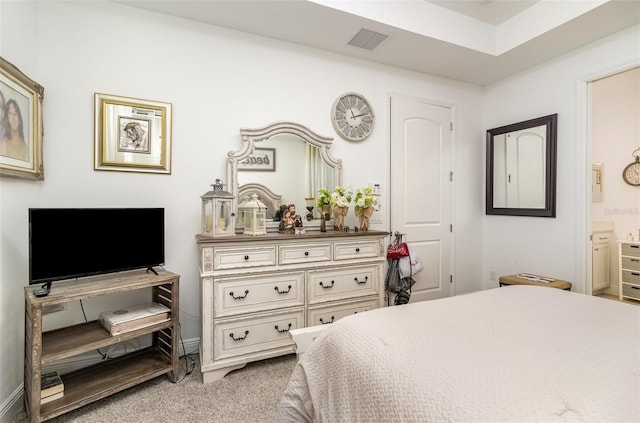 carpeted bedroom with ensuite bathroom