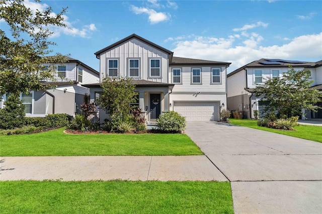 view of front of house with a garage and a front yard