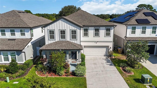 view of front of home featuring a garage and a front lawn