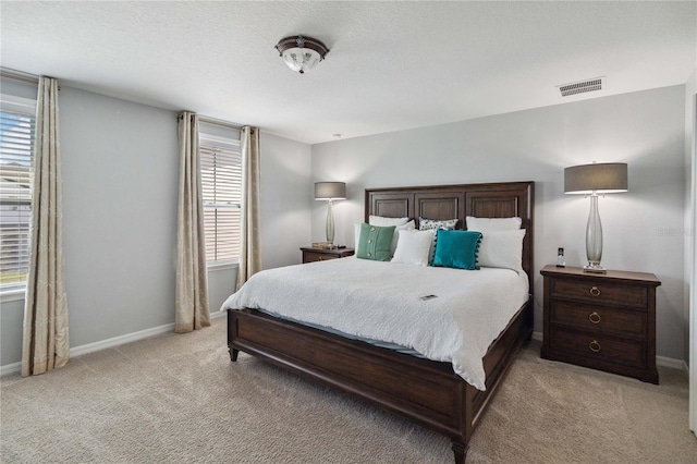 bedroom with light colored carpet