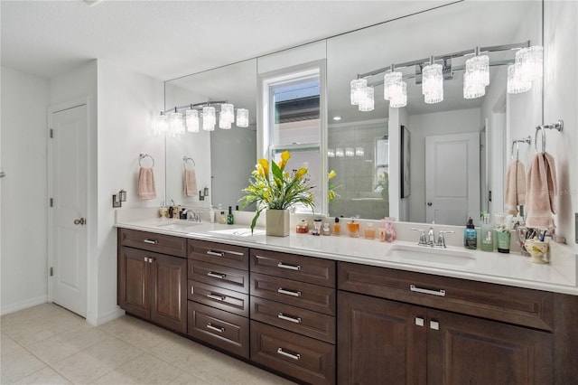 bathroom featuring vanity, tile patterned flooring, and a shower with shower door