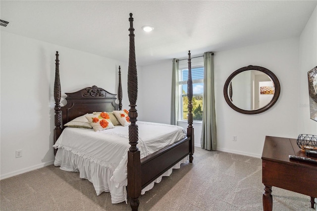 bedroom featuring light colored carpet