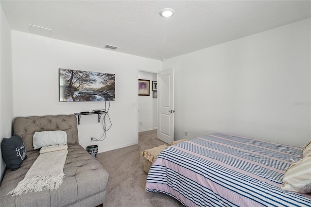 bedroom with light colored carpet