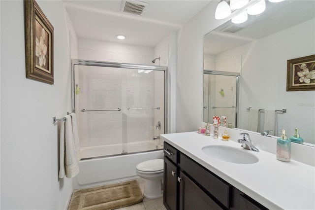 full bathroom with enclosed tub / shower combo, vanity, toilet, and tile patterned flooring