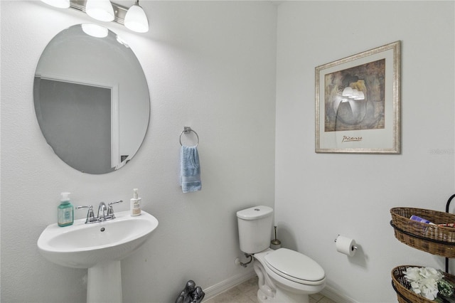 bathroom featuring tile patterned floors and toilet