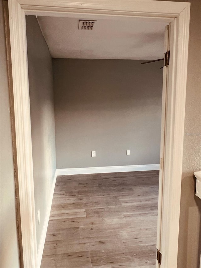 spare room featuring light hardwood / wood-style floors