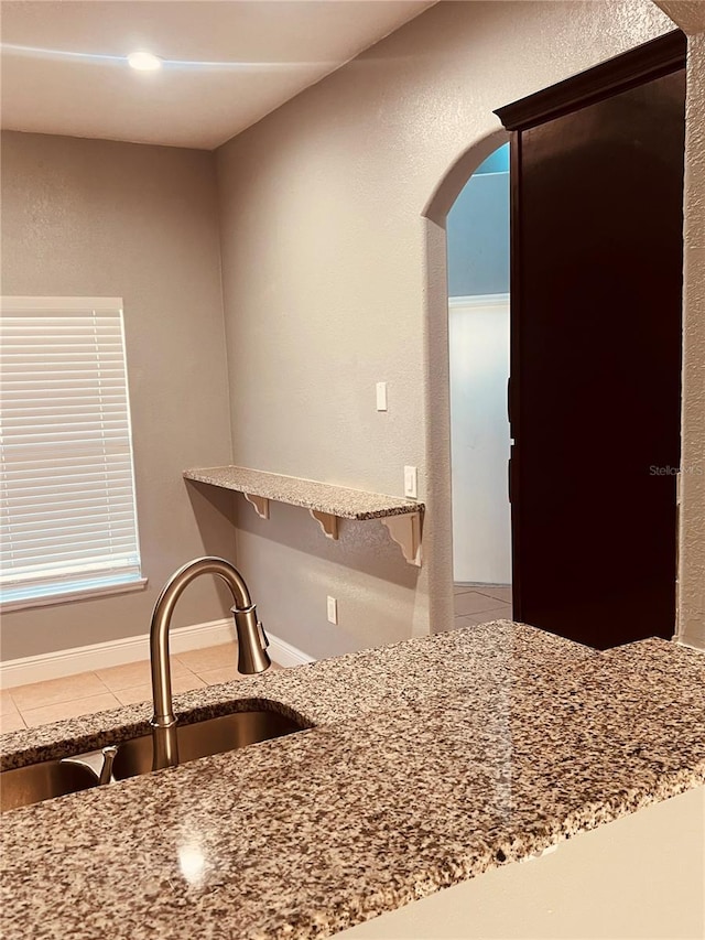 kitchen featuring sink and tile patterned floors