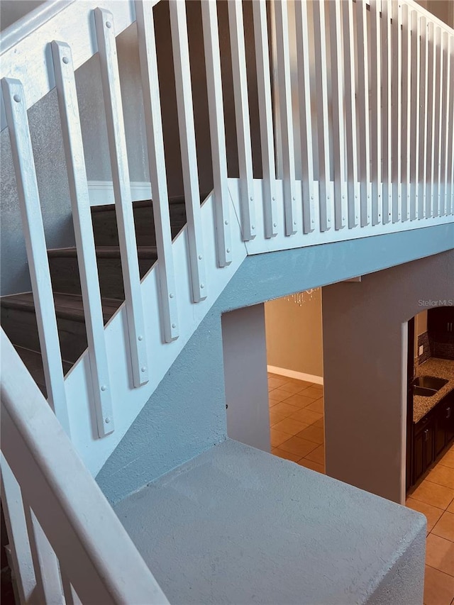 staircase with tile patterned flooring