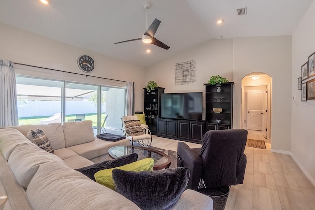 living room featuring ceiling fan and high vaulted ceiling