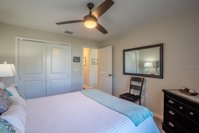 bedroom featuring carpet floors, ceiling fan, and a closet