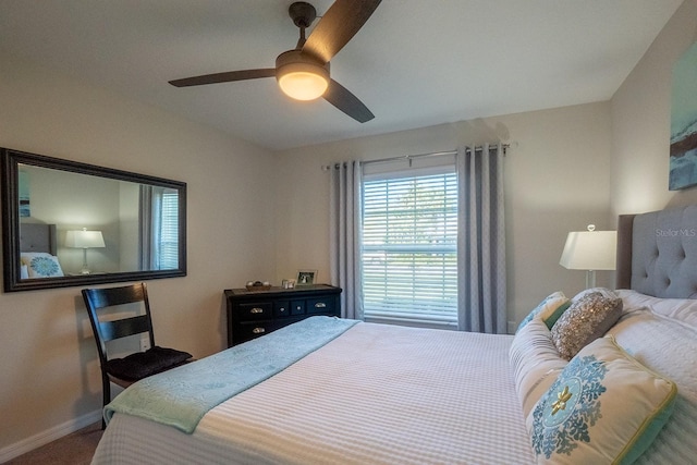 bedroom with ceiling fan and carpet flooring