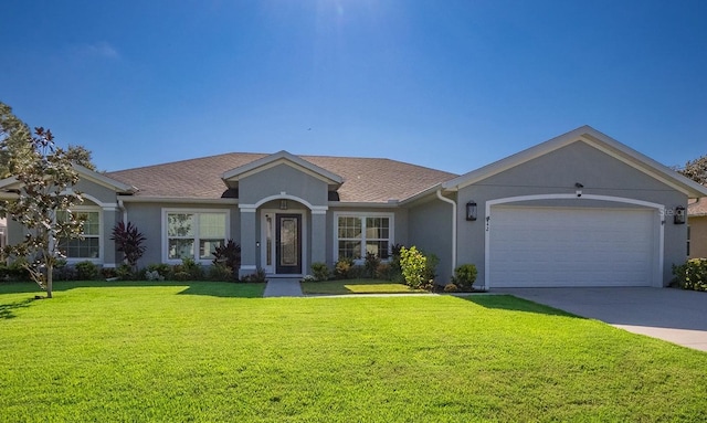 ranch-style home featuring a garage and a front lawn