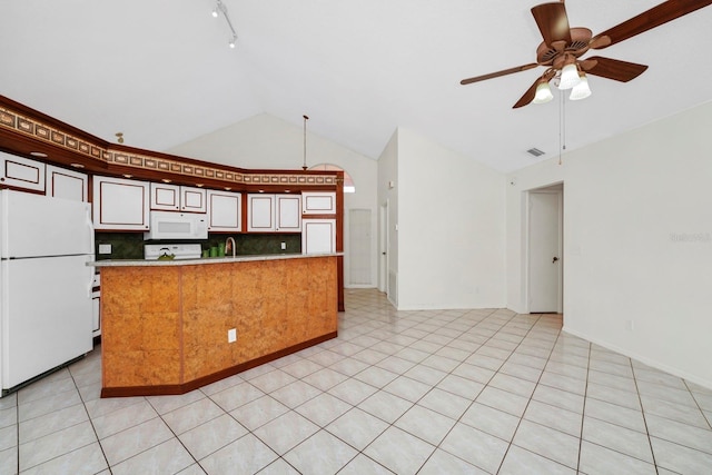 kitchen featuring tasteful backsplash, sink, white appliances, light tile patterned floors, and ceiling fan