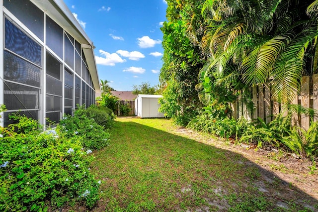 view of yard featuring a storage unit