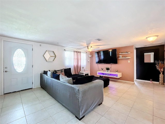 tiled living room featuring ceiling fan