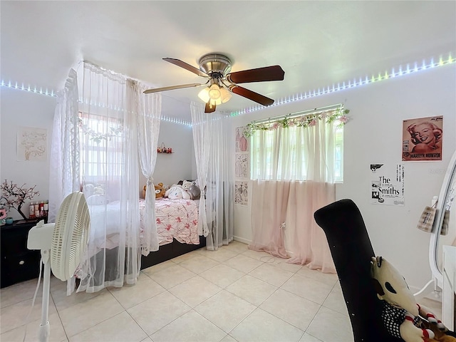 bedroom with light tile patterned floors and ceiling fan