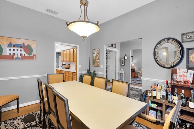 dining room with dark wood-type flooring