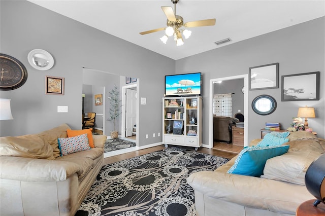 living room with ceiling fan and hardwood / wood-style floors